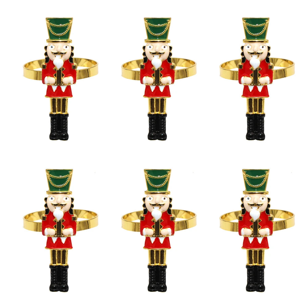 Set of six nutcracker-shaped napkin rings on a white background