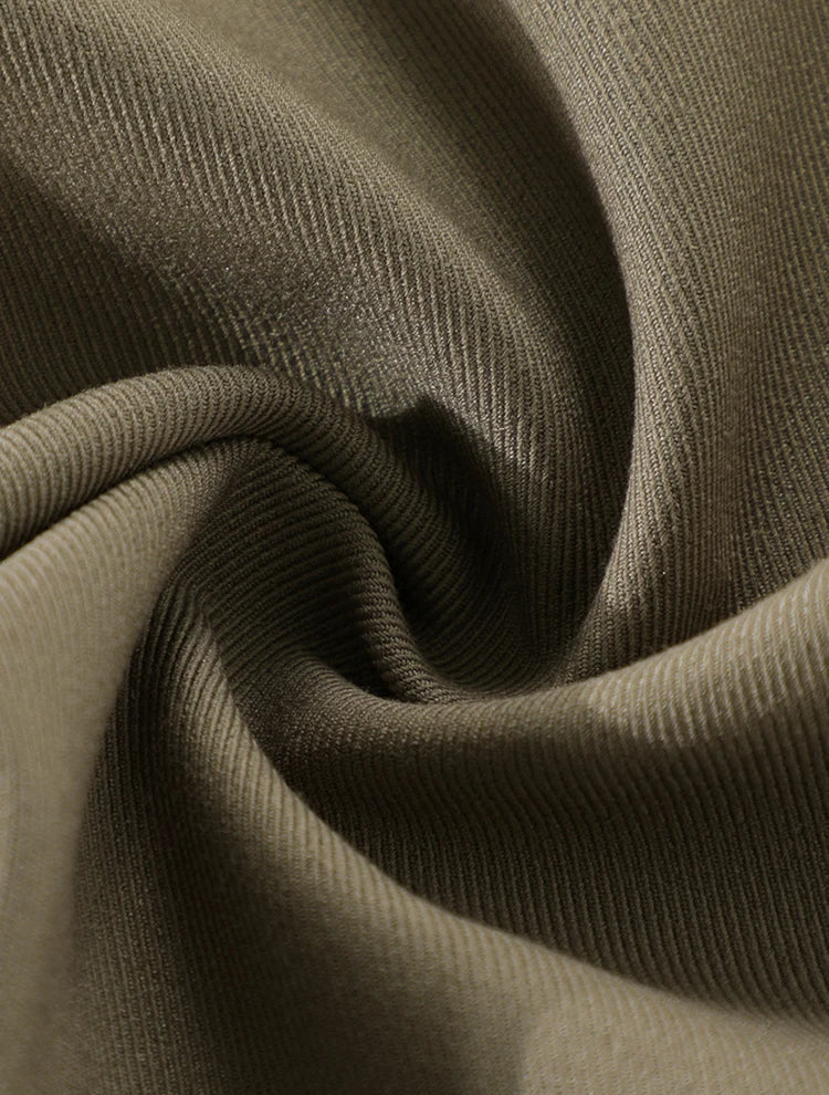 Close-up of olive green fabric with a textured pattern