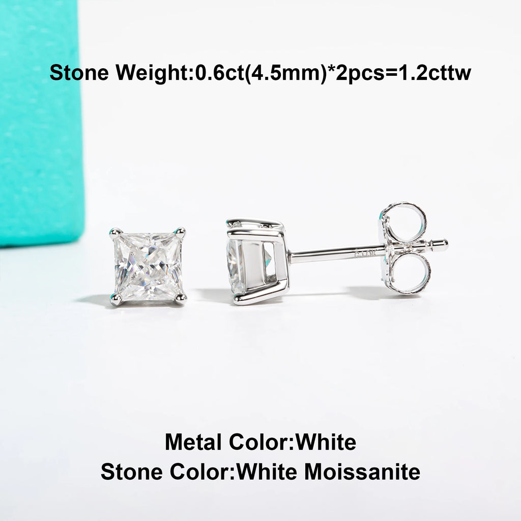Silver earrings with white moissanite stones on a light gray background