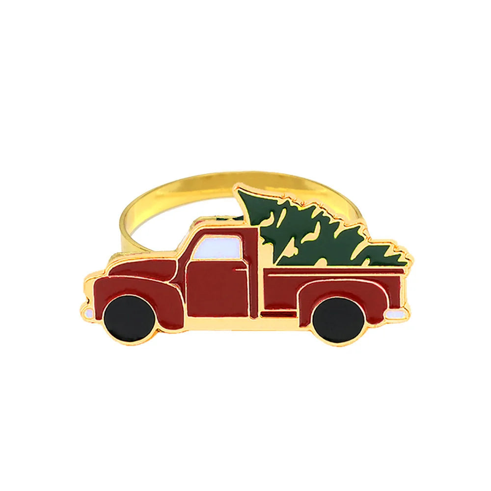Ring shaped like a red truck with a green tree on a white background