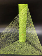 Green mesh fabric with a cylindrical green object on a black background