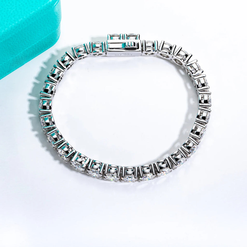 Silver bracelet with clear stones on a white background