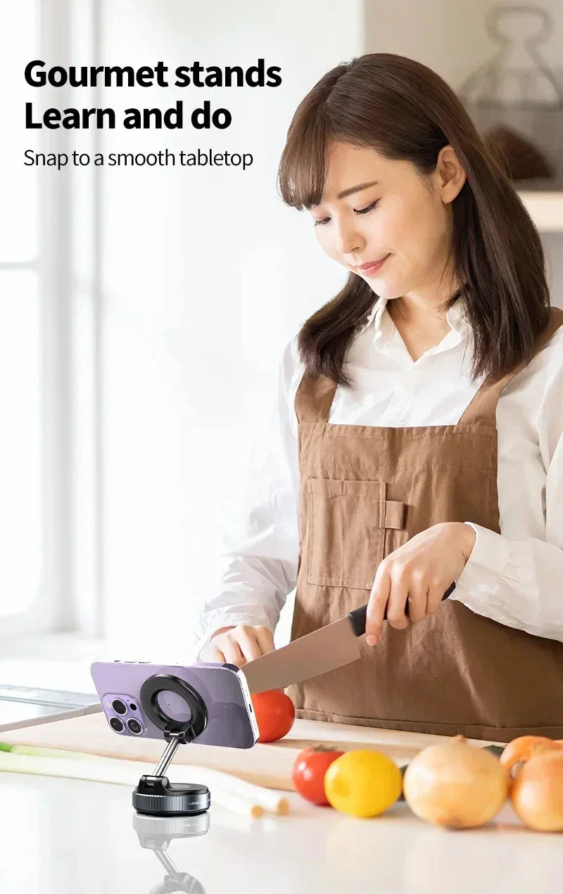 Woman in a kitchen using a smartphone stand with vegetables on the table
