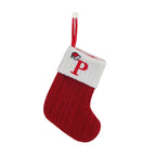 Red Christmas stocking with white cuff featuring a letter 'P' on a white background