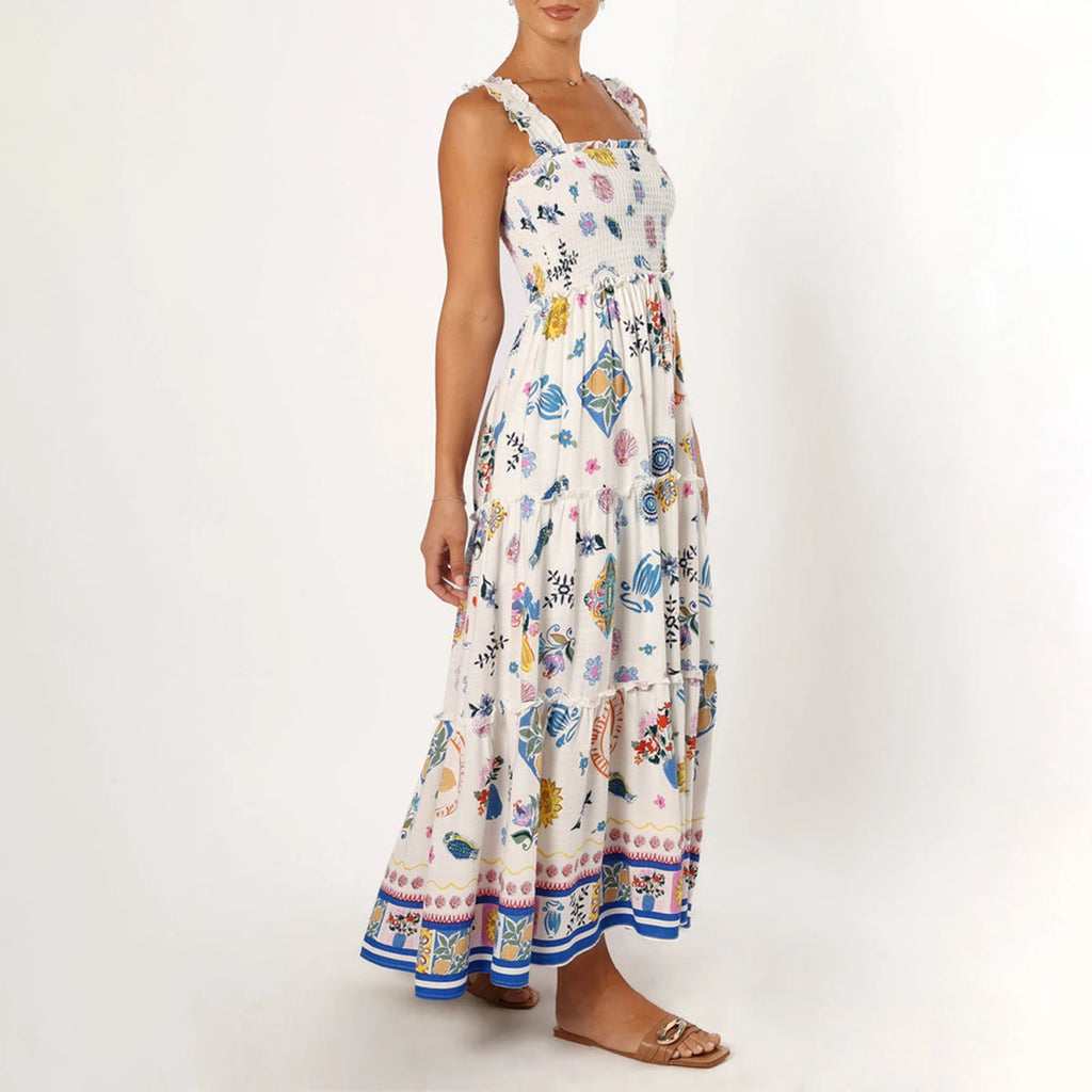 Woman wearing a floral patterned dress on a white background