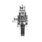 Silver nutcracker-shaped ring on a white background