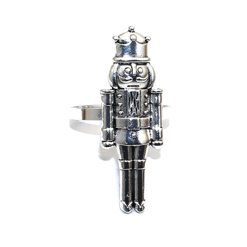 Silver nutcracker-shaped ring on a white background