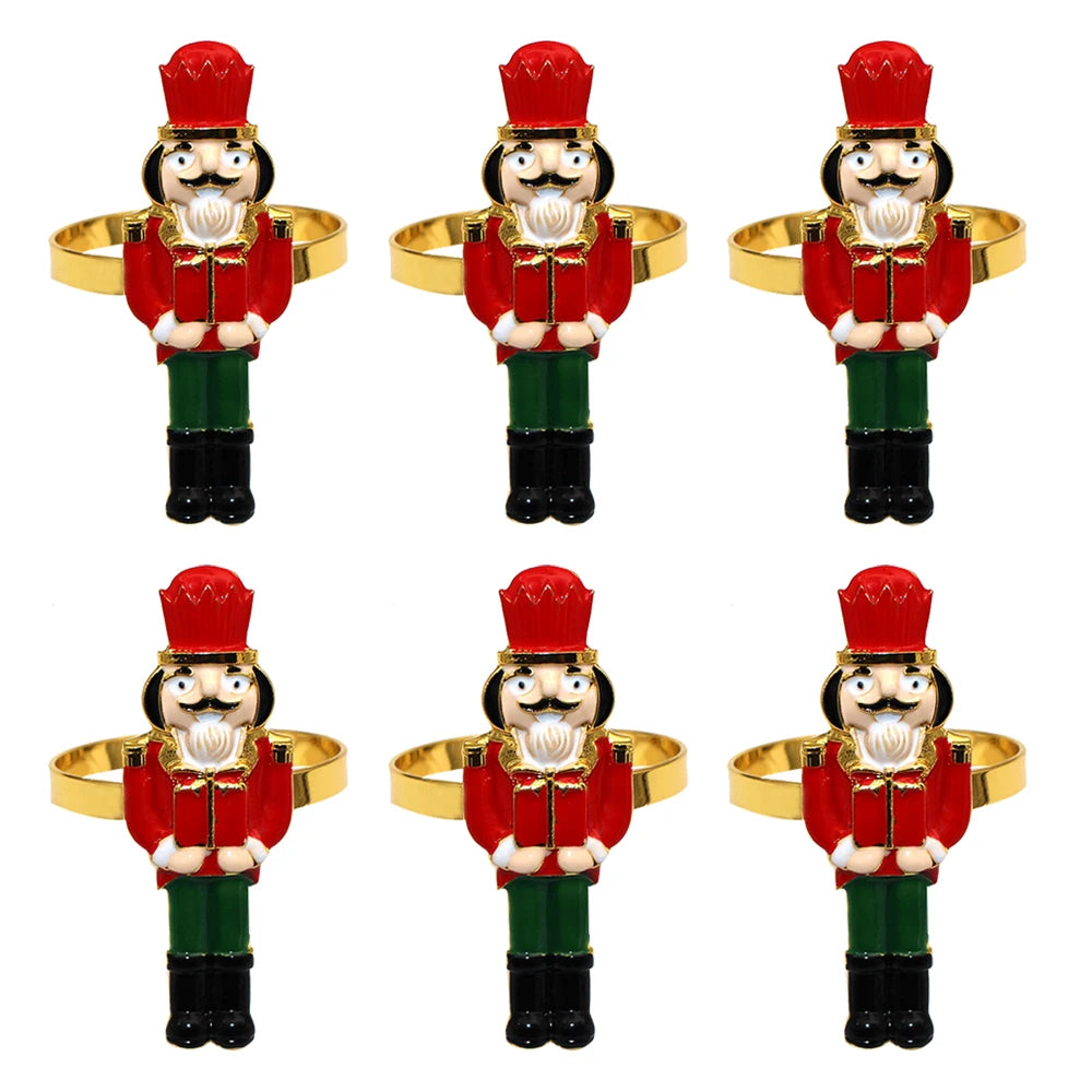 Set of six nutcracker-shaped napkin rings on a white background