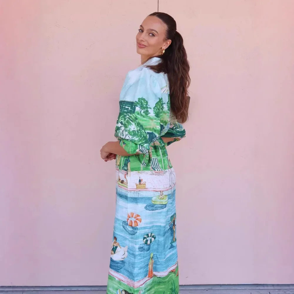 Woman wearing a colorful patterned dress against a pink background
