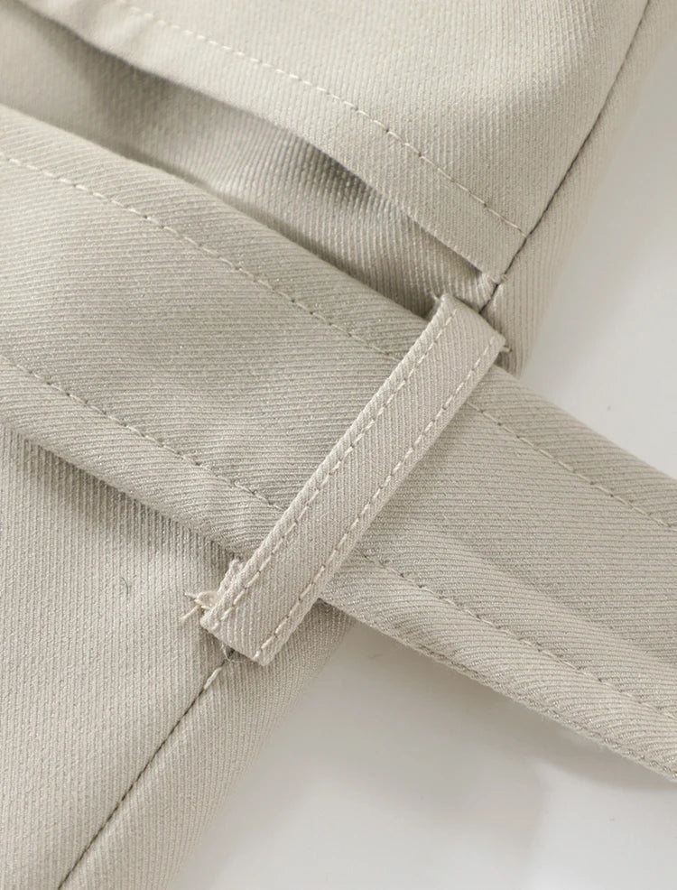 Close-up of a beige fabric with a label on a white background