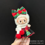Small plush toy with a large red bow on a black background