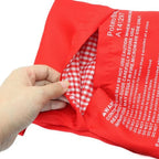 Red potato bag with checkered interior, held by a hand on a white background