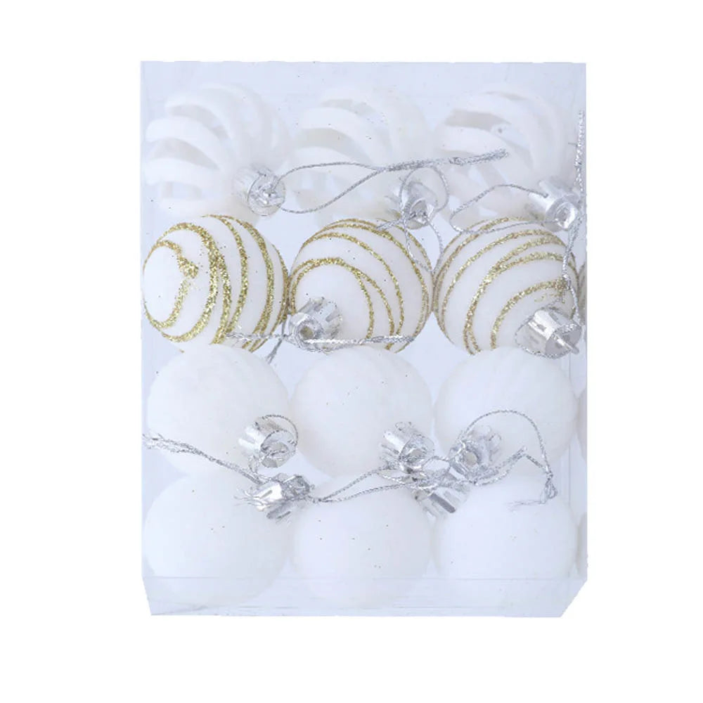 Set of white and gold Christmas ornaments in packaging