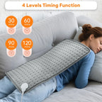 Woman lying on a couch with a gray heating pad, displaying timing functions.