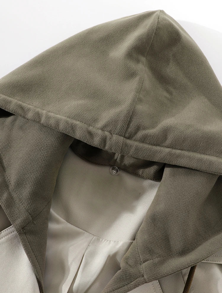 Close-up of a hooded garment with a neutral background