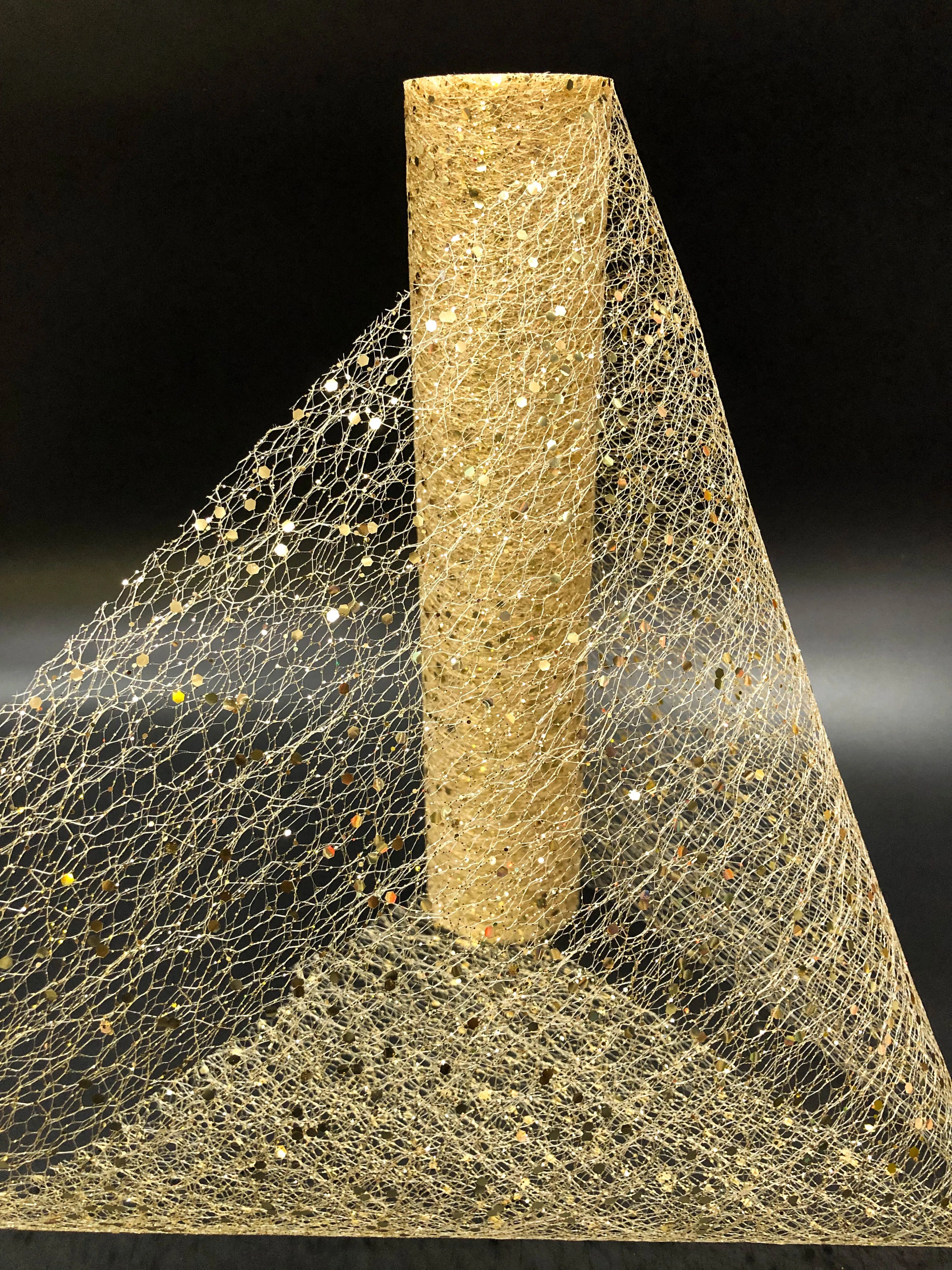 Textured cylindrical object with a mesh-like material on a black background