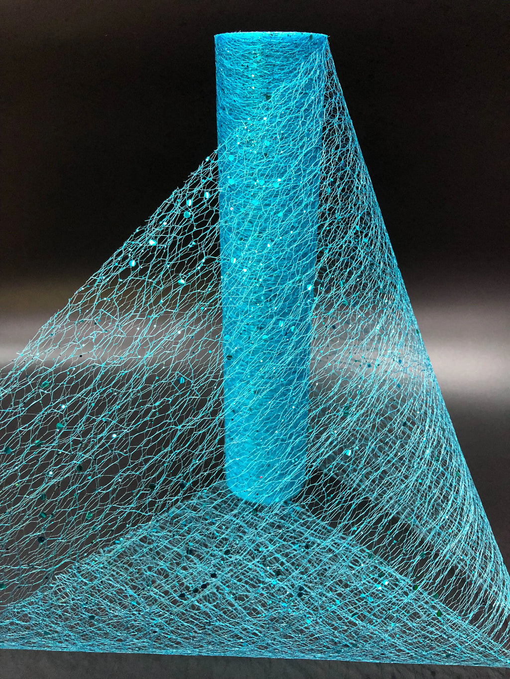 Turquoise fishing net on a black background