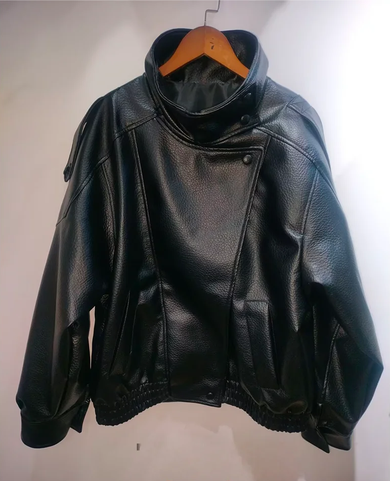 Black leather jacket on a hanger against a plain background with 'Luxurious' text.