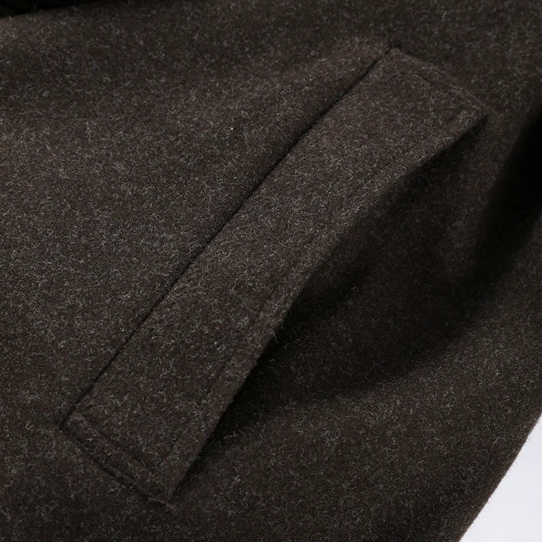 Close-up of a dark gray fabric with a pocket detail
