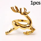 Gold deer-shaped ring on a white background