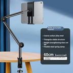 Tablet holder with adjustable arm on a wooden table against a blue background