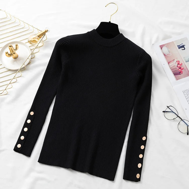 Black turtleneck sweater with button details on a white surface