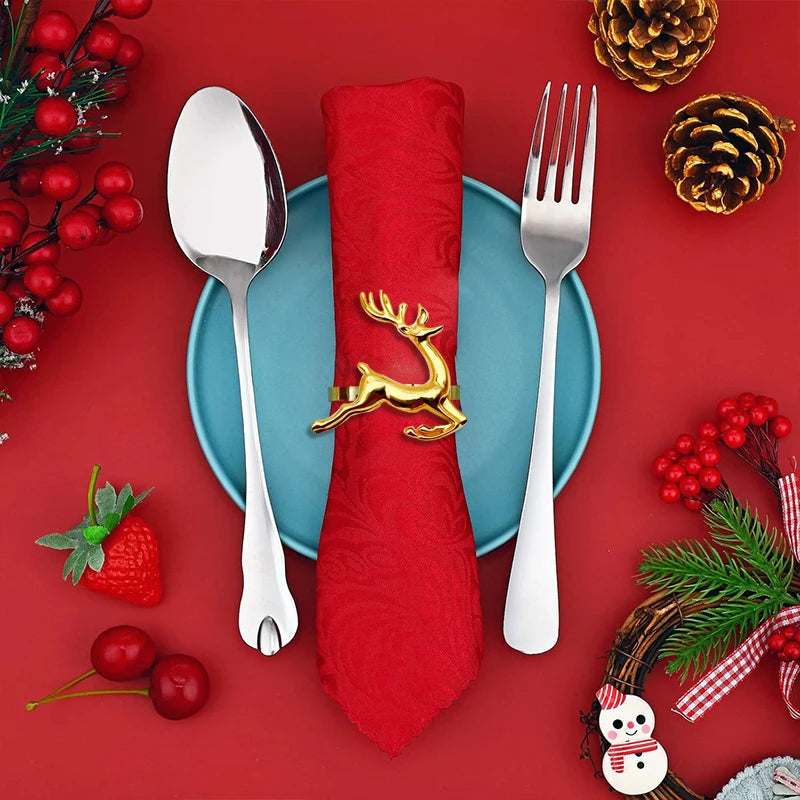 Christmas-themed table setting with red napkin, silverware, and festive decorations on a red background.