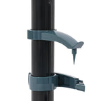 Teal bicycle water bottle holder attached to a black pole on a white background