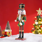 Decorative nutcracker figure with a red background and Christmas trees.