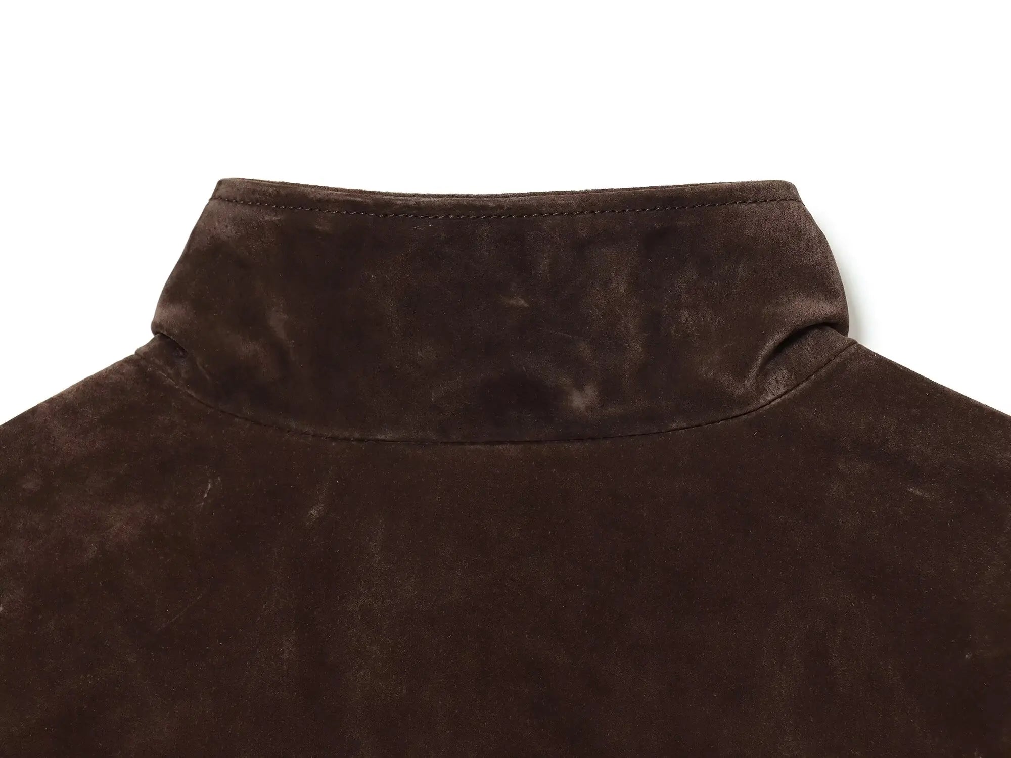 Close-up of a brown fleece jacket collar on a white background