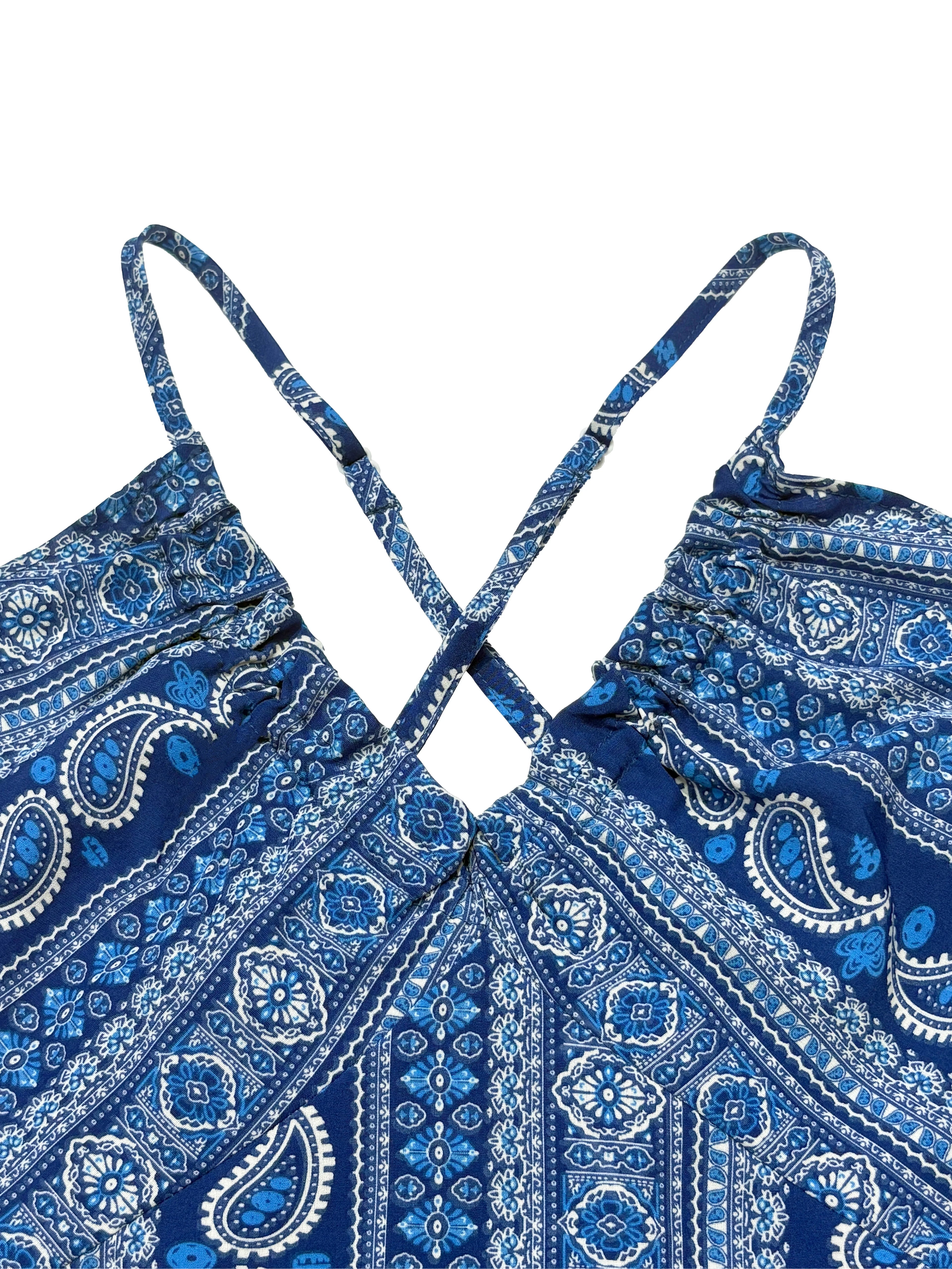 Blue paisley patterned top with crossed straps on a white background