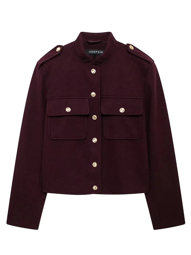 Maroon jacket with gold buttons on a white background