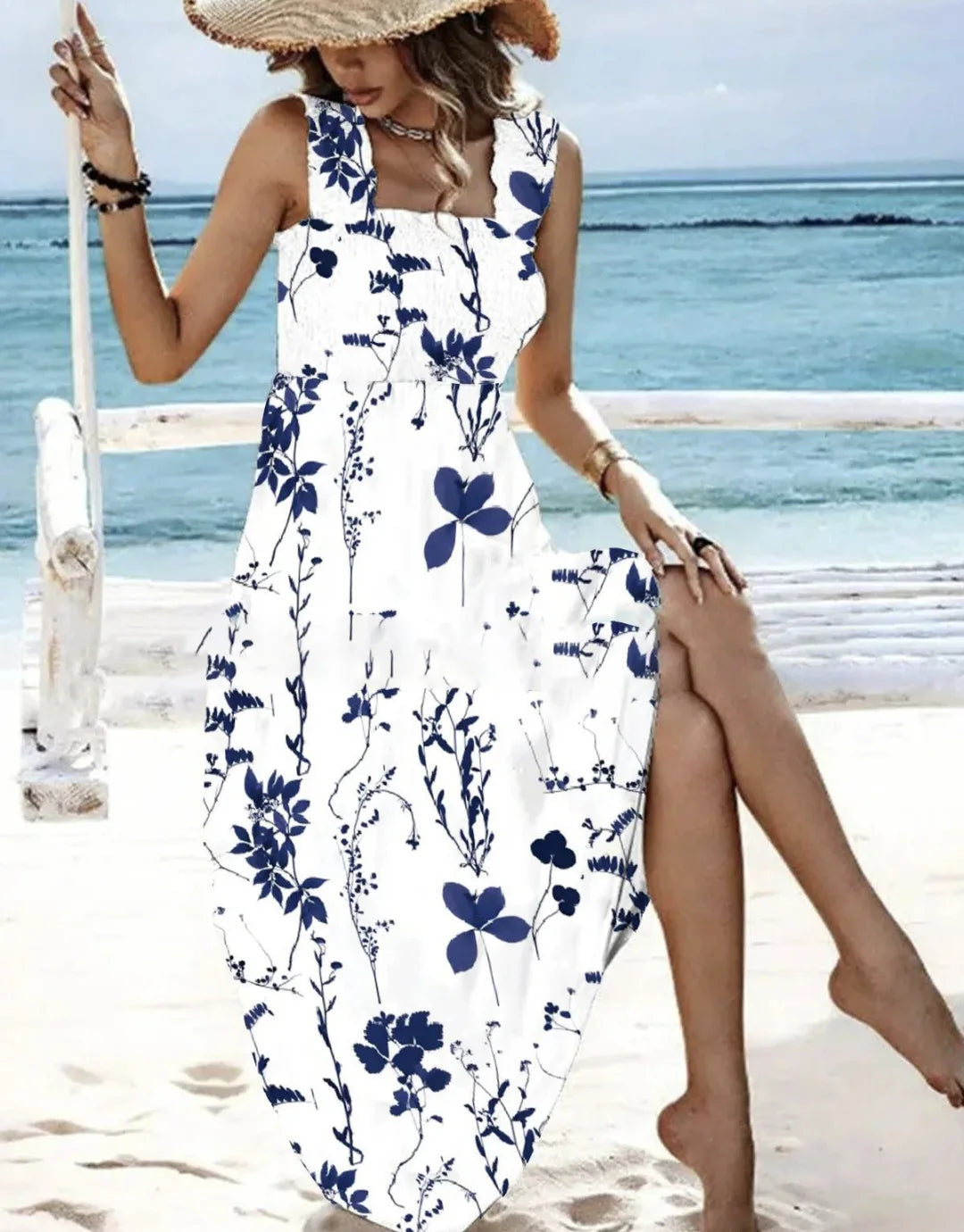 Woman in a floral dress by the ocean