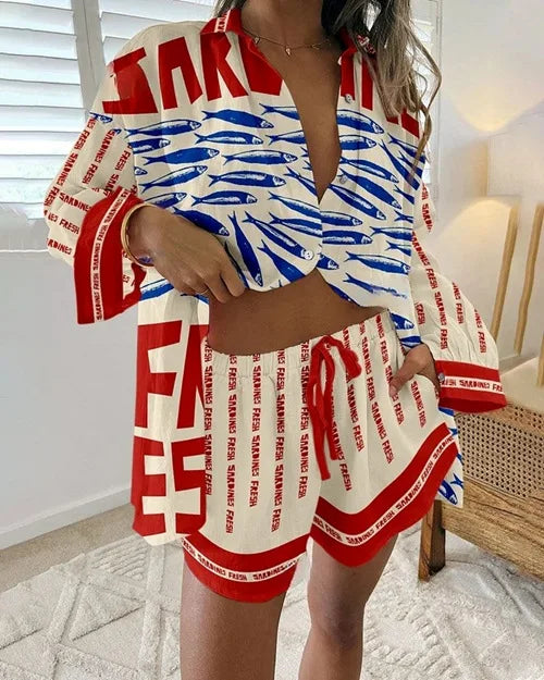 Person wearing a red, white, and blue outfit with text and fish pattern.
