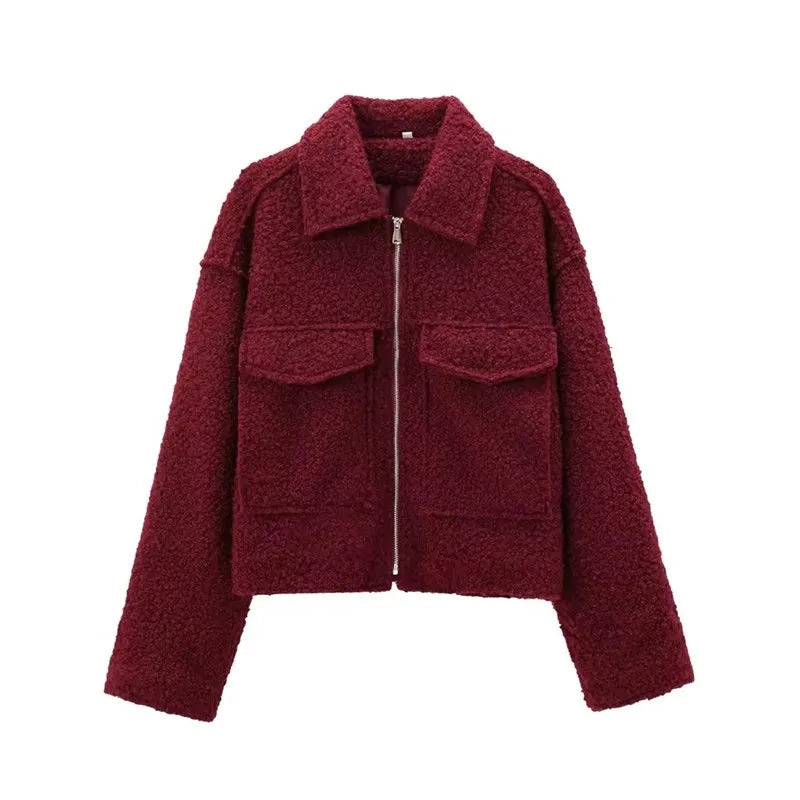 Maroon jacket with a zipper on a white background