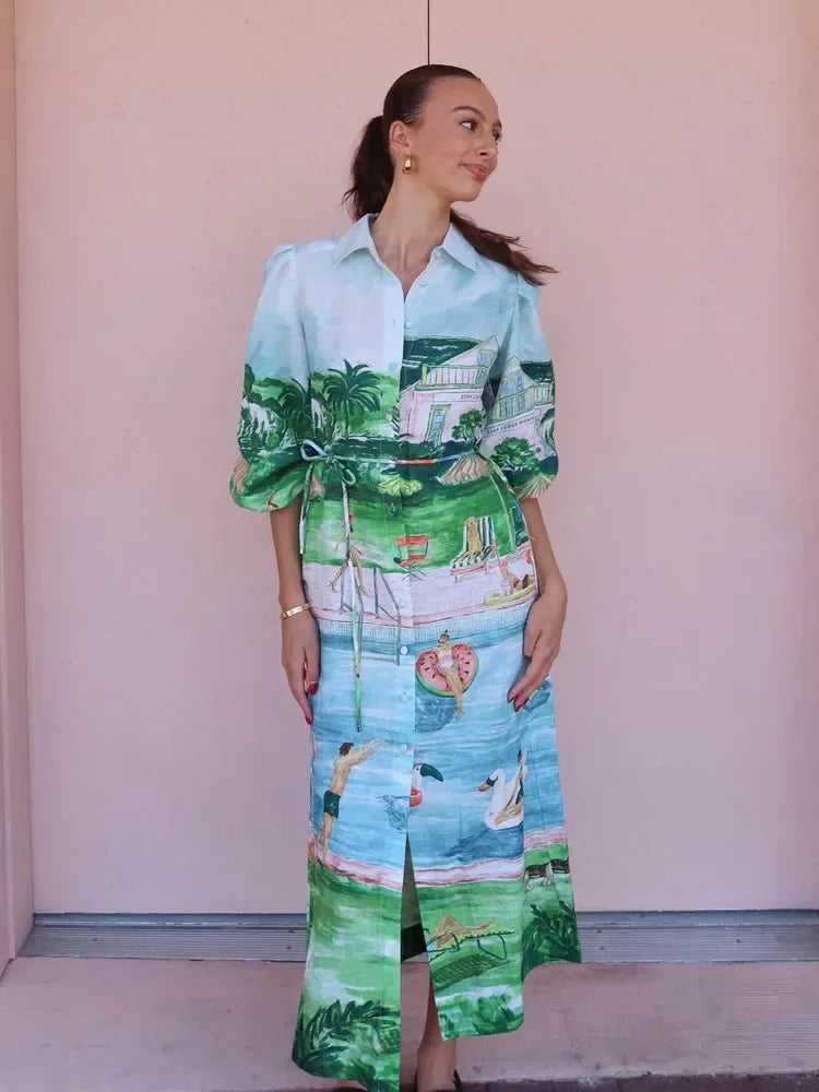 Woman wearing a colorful outfit with a palm tree pattern against a plain background