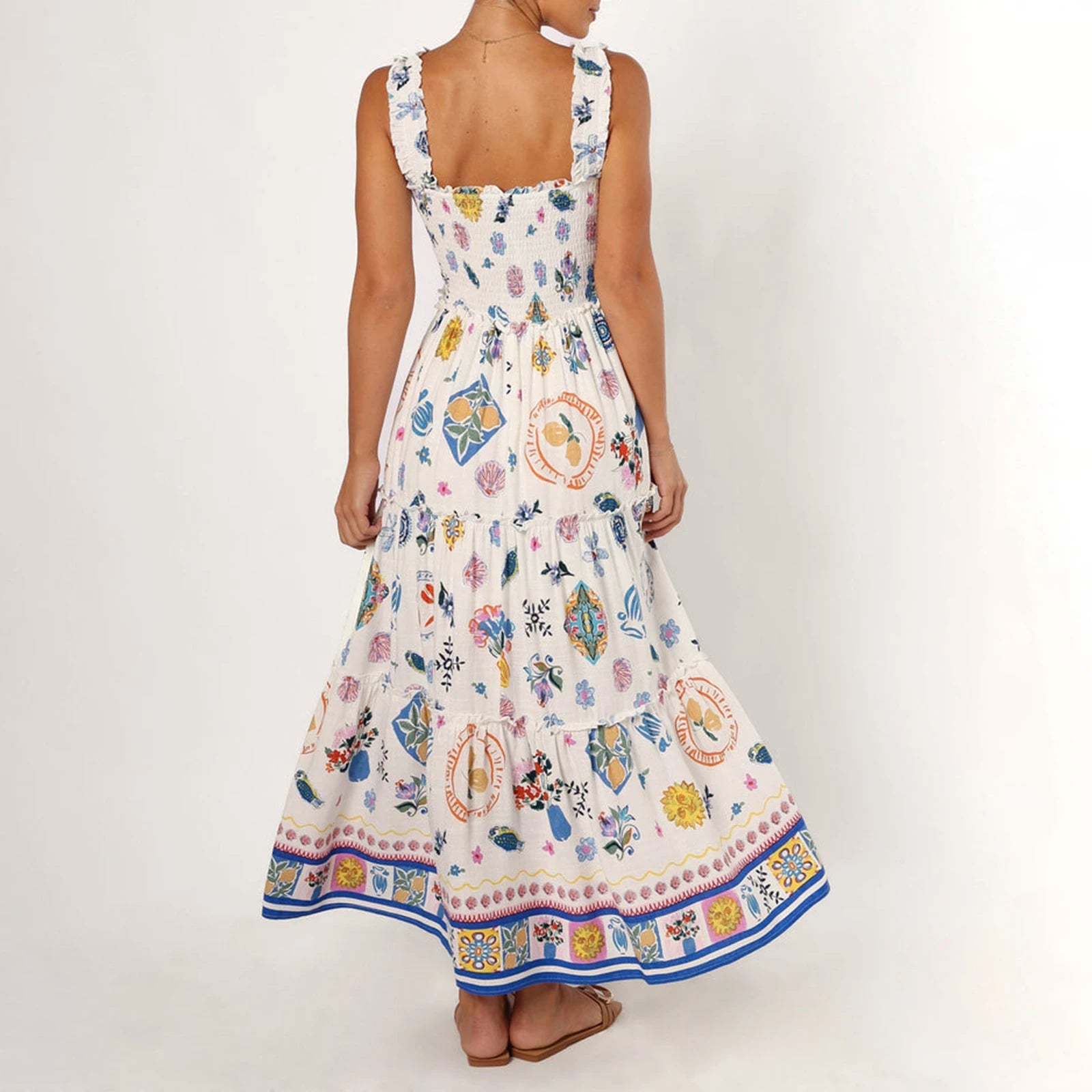 Woman wearing a colorful floral dress with a white background