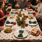 Group of people enjoying a festive meal with wine and Christmas decorations.