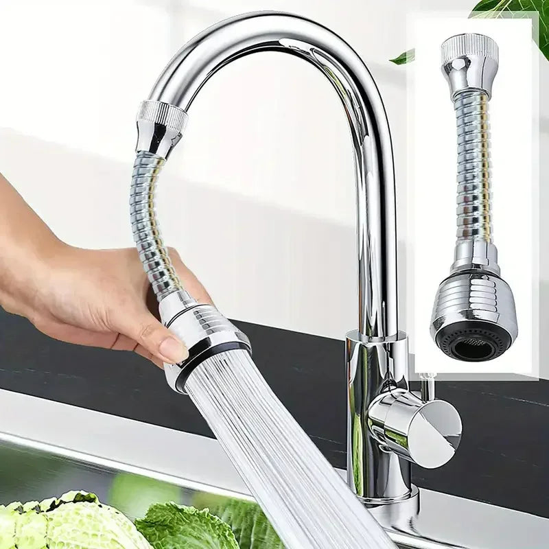 Chrome kitchen faucet with a handheld shower head and a sink in the background