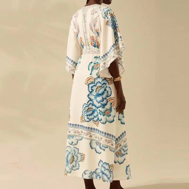 Woman wearing a floral dress with a beige background