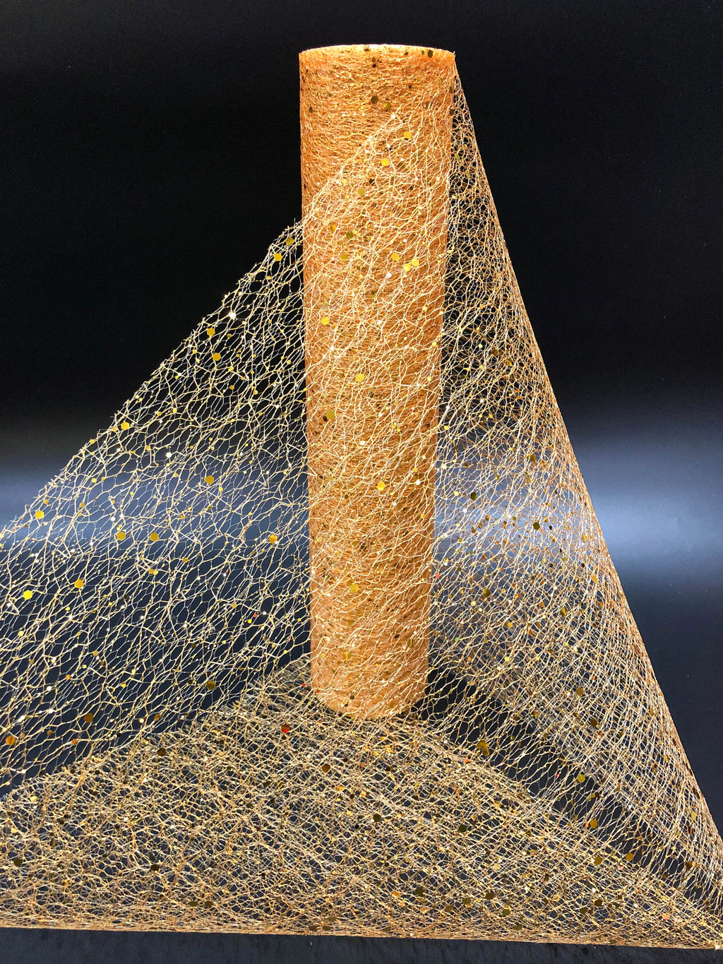 Textured cylindrical object with a mesh-like material on a black background