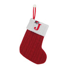 Red Christmas stocking with white cuff featuring a red letter 'J' on a white background