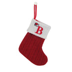 Red and white Christmas stocking with letter 'B' on a white background