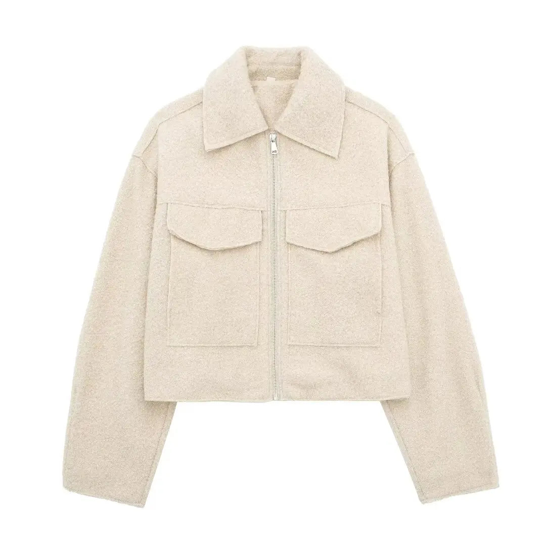 Beige jacket with a zipper on a white background