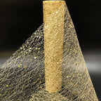 Gold glittery netting on a black background