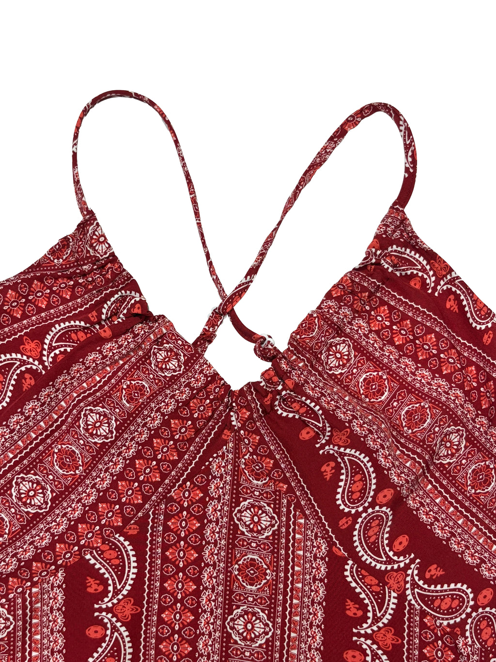 Red patterned top with thin straps on a white background