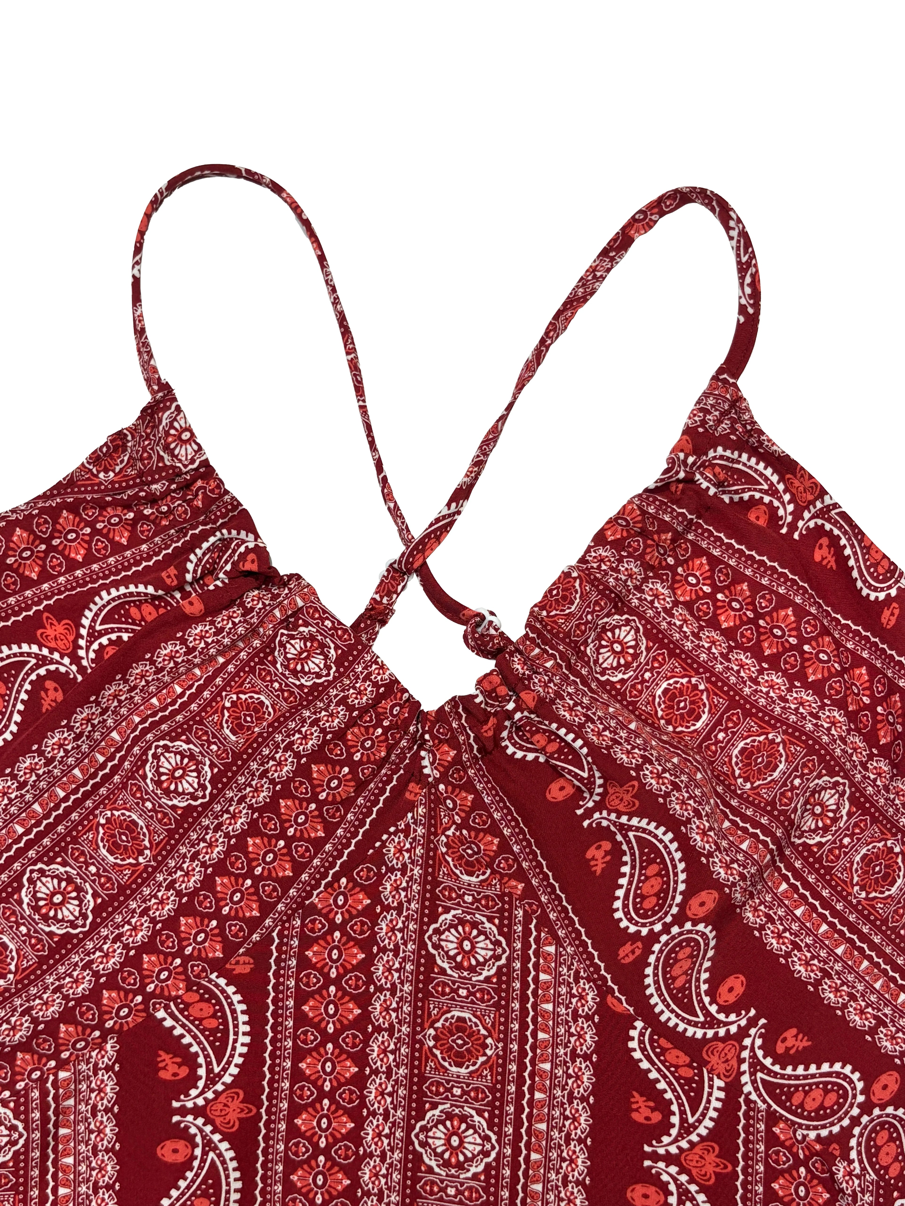 Red patterned top with thin straps on a white background