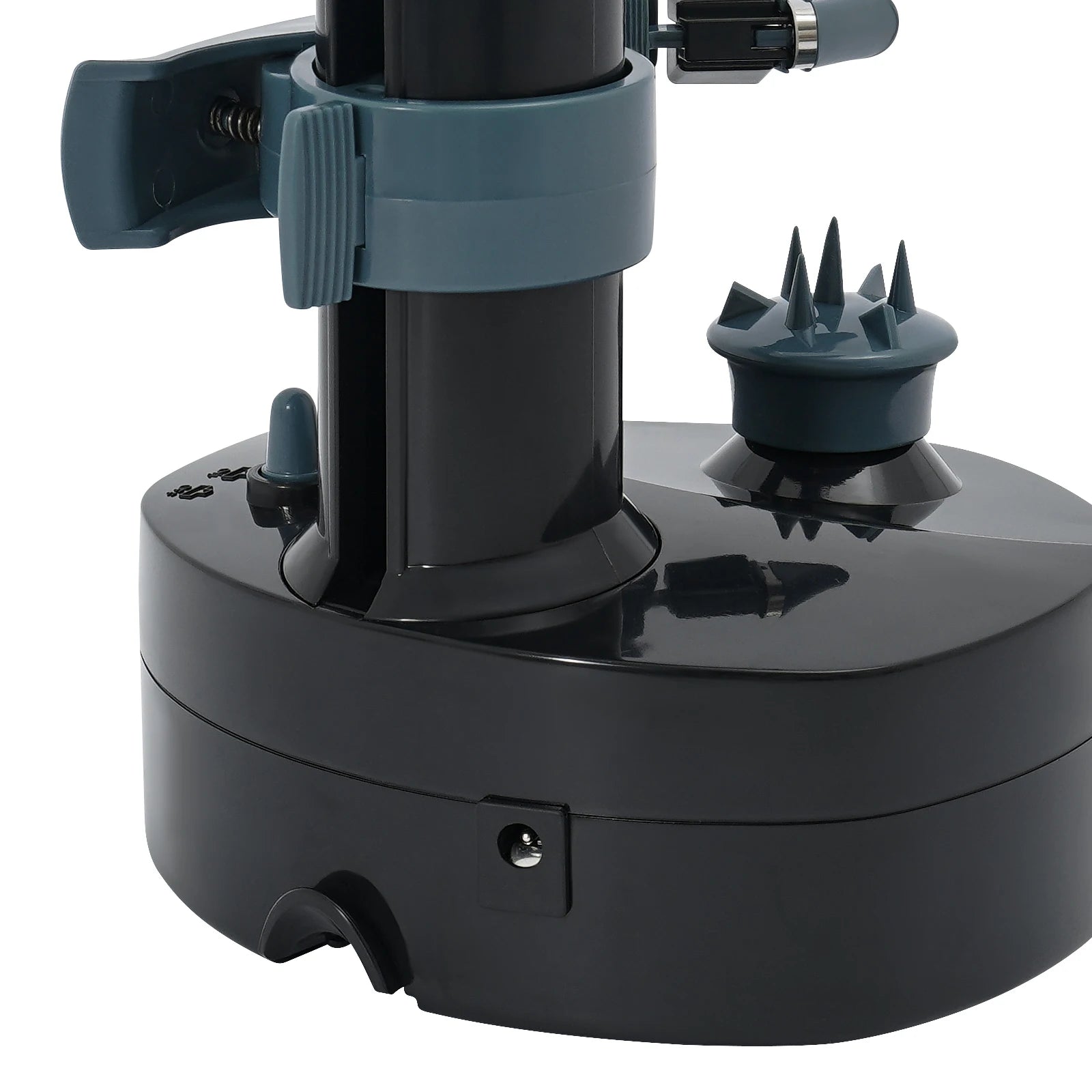 Black and gray mechanical device with a spiky top on a white background