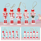 Set of Christmas-themed nutcracker ornaments with red and white attire on a light blue background.