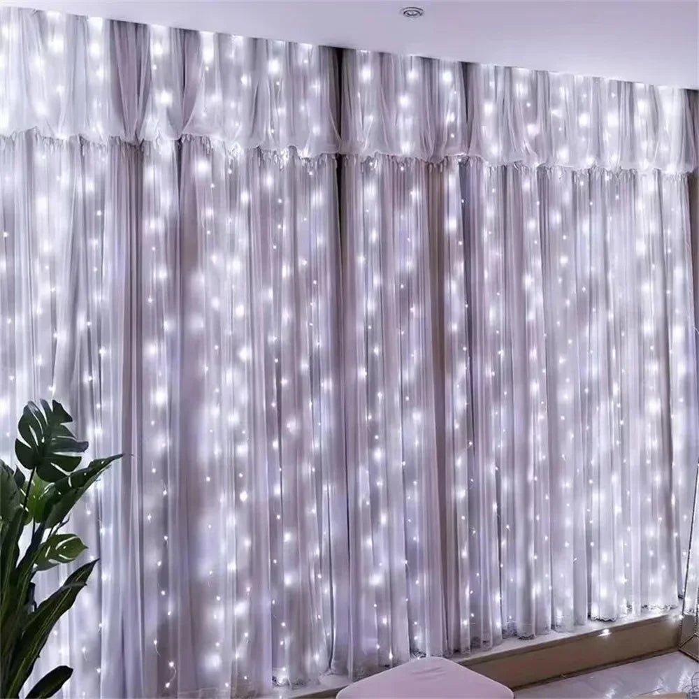 White string lights curtain with a plant on the left side